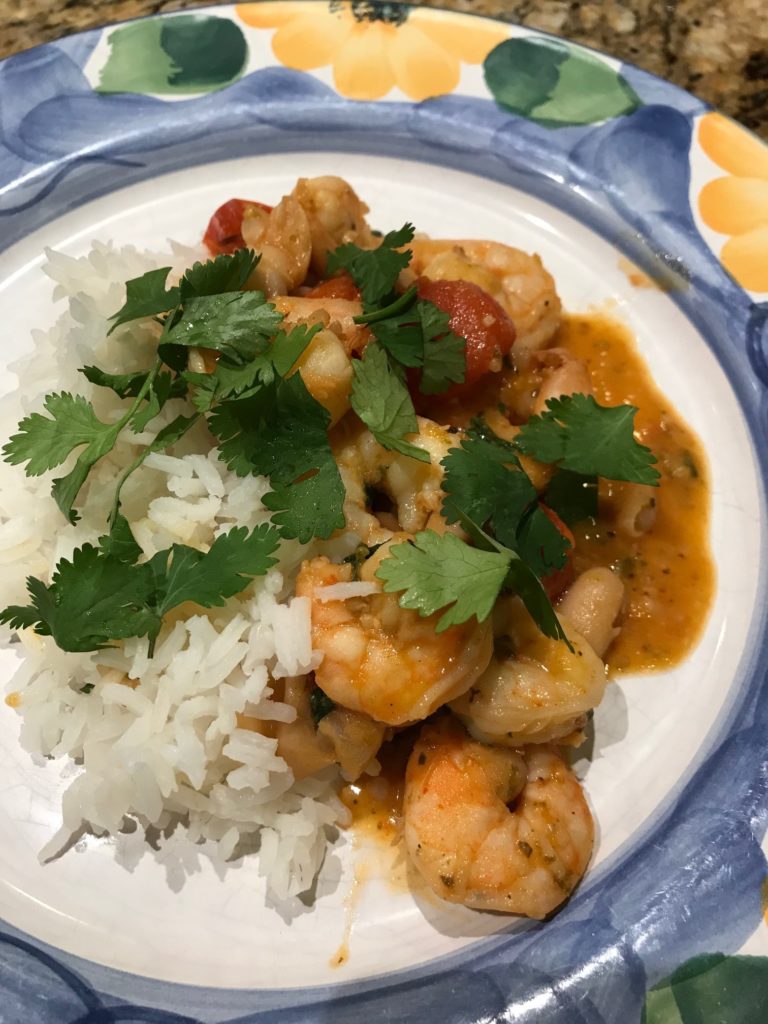 Garlicky Sauteed Shrimp with Creamy White Beans and Blistered Tomatoes